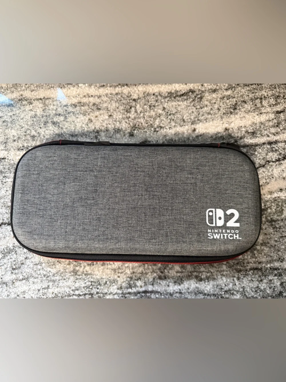 Nintendo Switch 2 Gray Carry Case with Red Zipper Accent